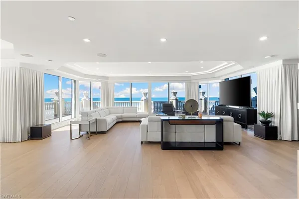 a living room with fireplace furniture and a flat screen tv