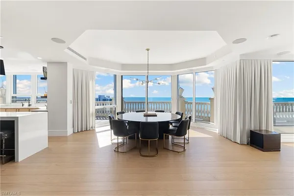 a view of a dining room with furniture window and outside view