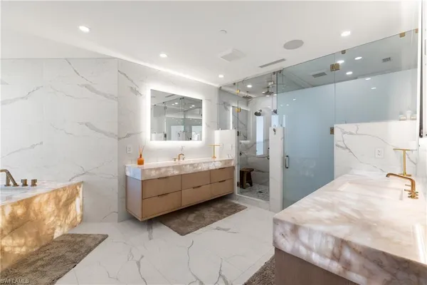 a room with a bed and a dresser