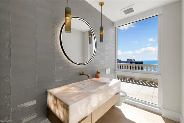 a bathroom with a sink a mirror and a shower