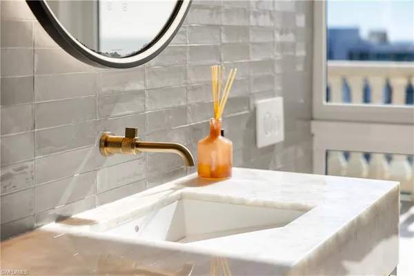a bathroom with a sink and a mirror