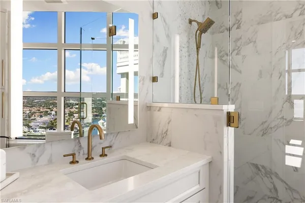 a bathroom with a sink and a large mirror