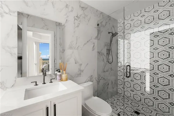 a bathroom with a sink and toilet