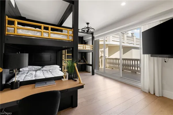 a bedroom with furniture and a window