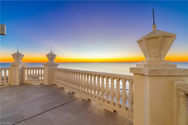 a view of balcony with a swimming pool