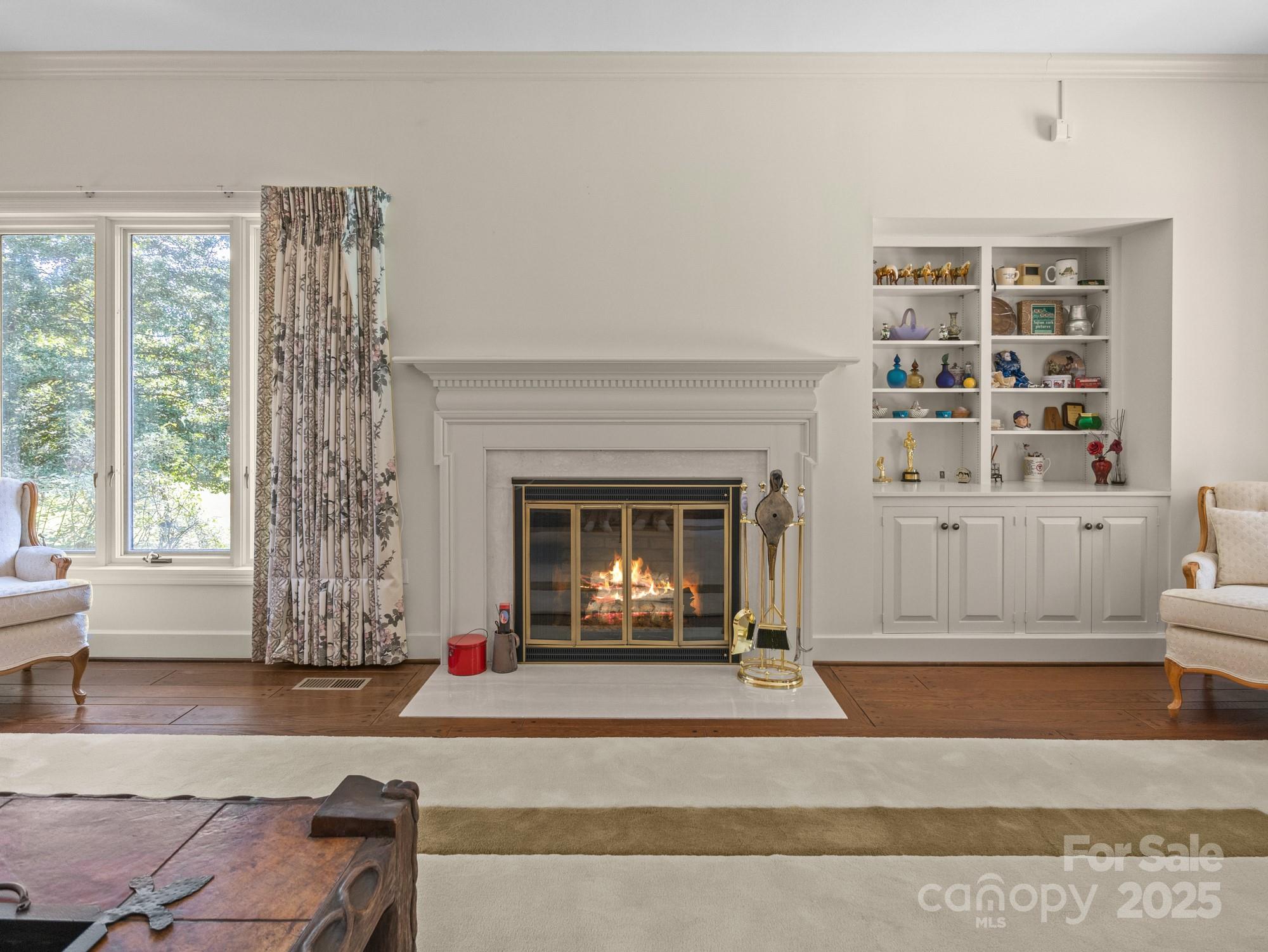 831 Hooper Creek Road Tryon, NC 28782 - Photo 13 of 48 a living room with furniture and a fireplace