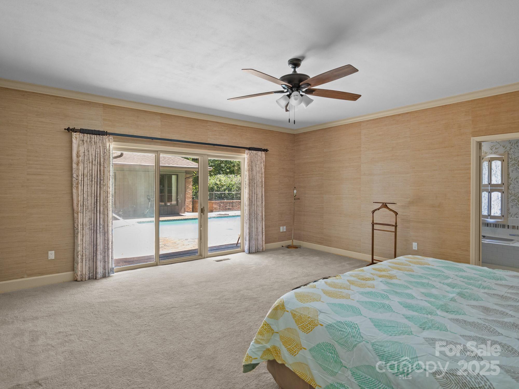 831 Hooper Creek Road Tryon, NC 28782 - Photo 20 of 48 a bedroom with a large bed and a window