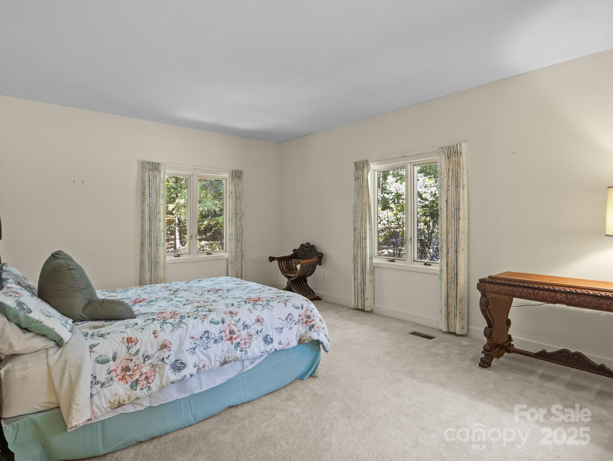 831 Hooper Creek Road Tryon, NC 28782 - Photo 24 of 48 a bedroom with a bed and a window