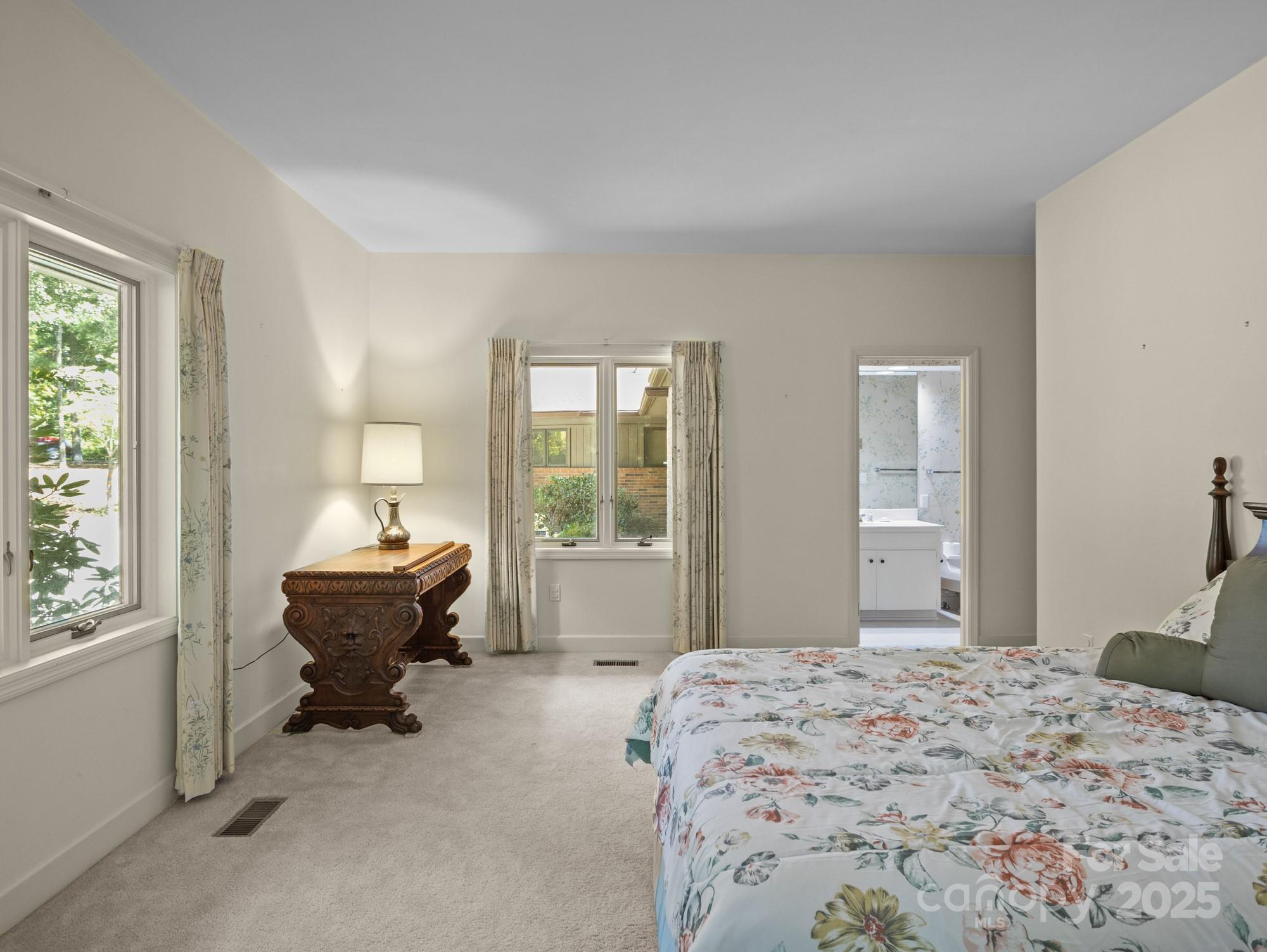 831 Hooper Creek Road Tryon, NC 28782 - Photo 25 of 48 a bedroom with bed chair and window