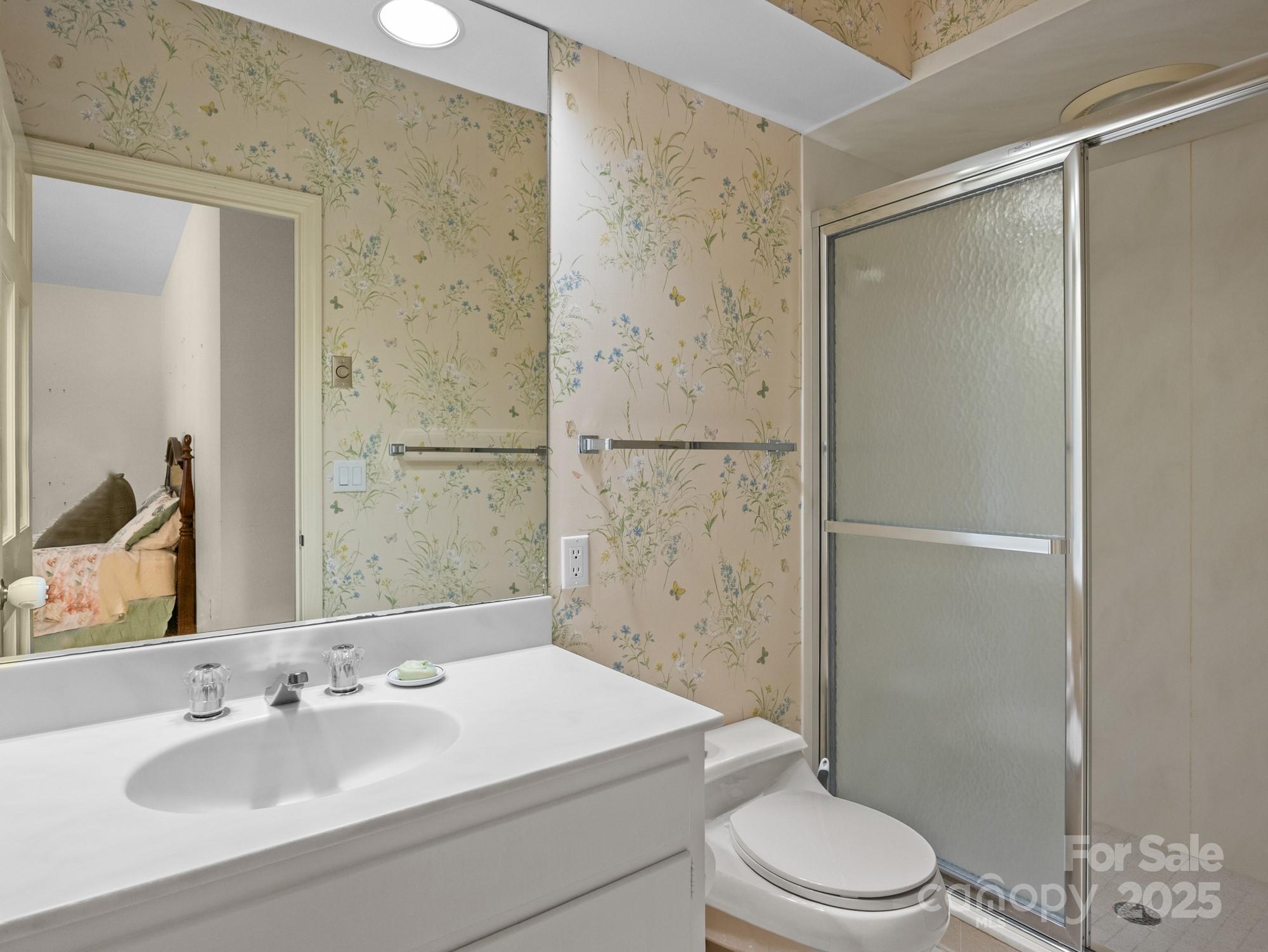 831 Hooper Creek Road Tryon, NC 28782 - Photo 26 of 48 a bathroom with a sink a toilet and shower