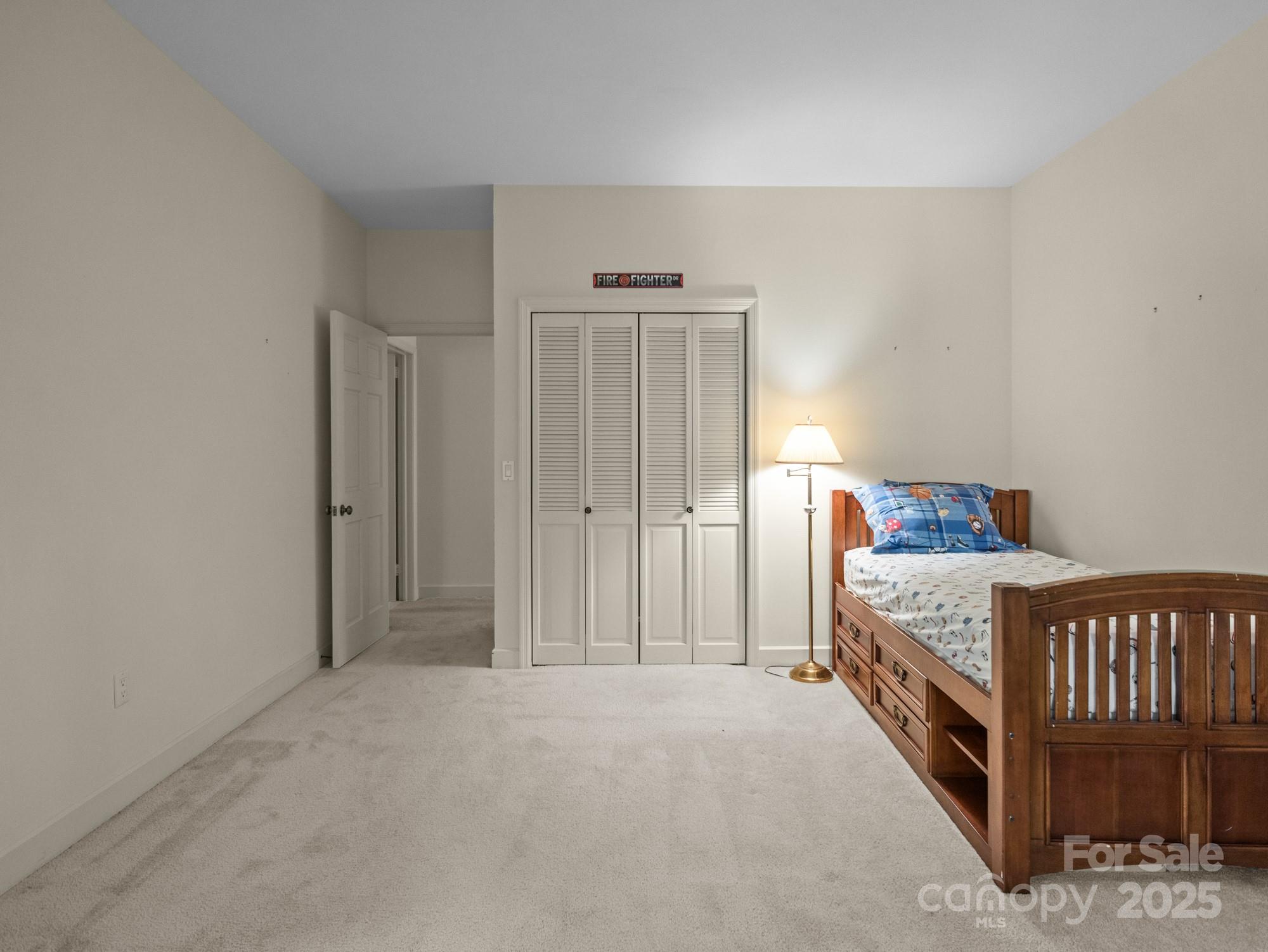 831 Hooper Creek Road Tryon, NC 28782 - Photo 28 of 48 a bedroom with a bed and a window