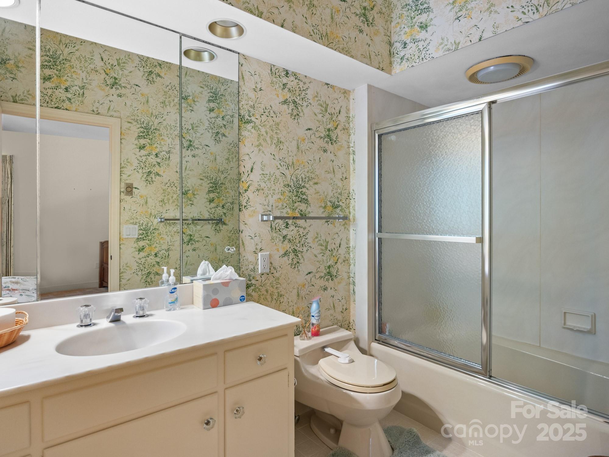 831 Hooper Creek Road Tryon, NC 28782 - Photo 29 of 48 a bathroom with a sink toilet and shower