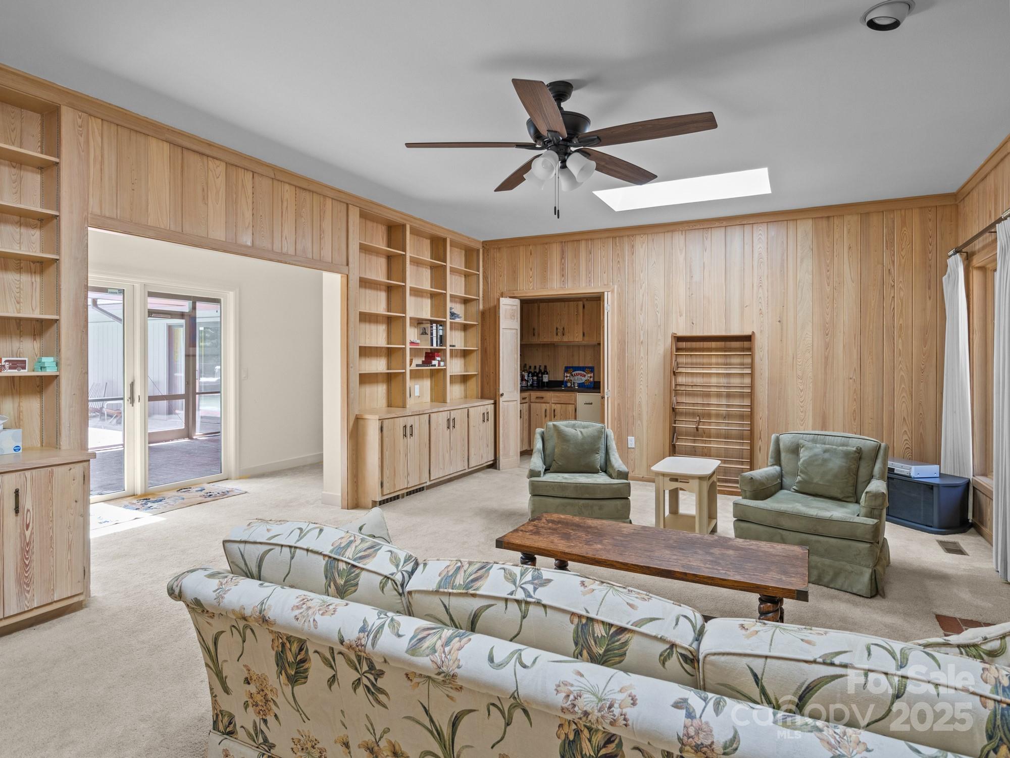 831 Hooper Creek Road Tryon, NC 28782 - Photo 30 of 48 a living room with furniture and a large window