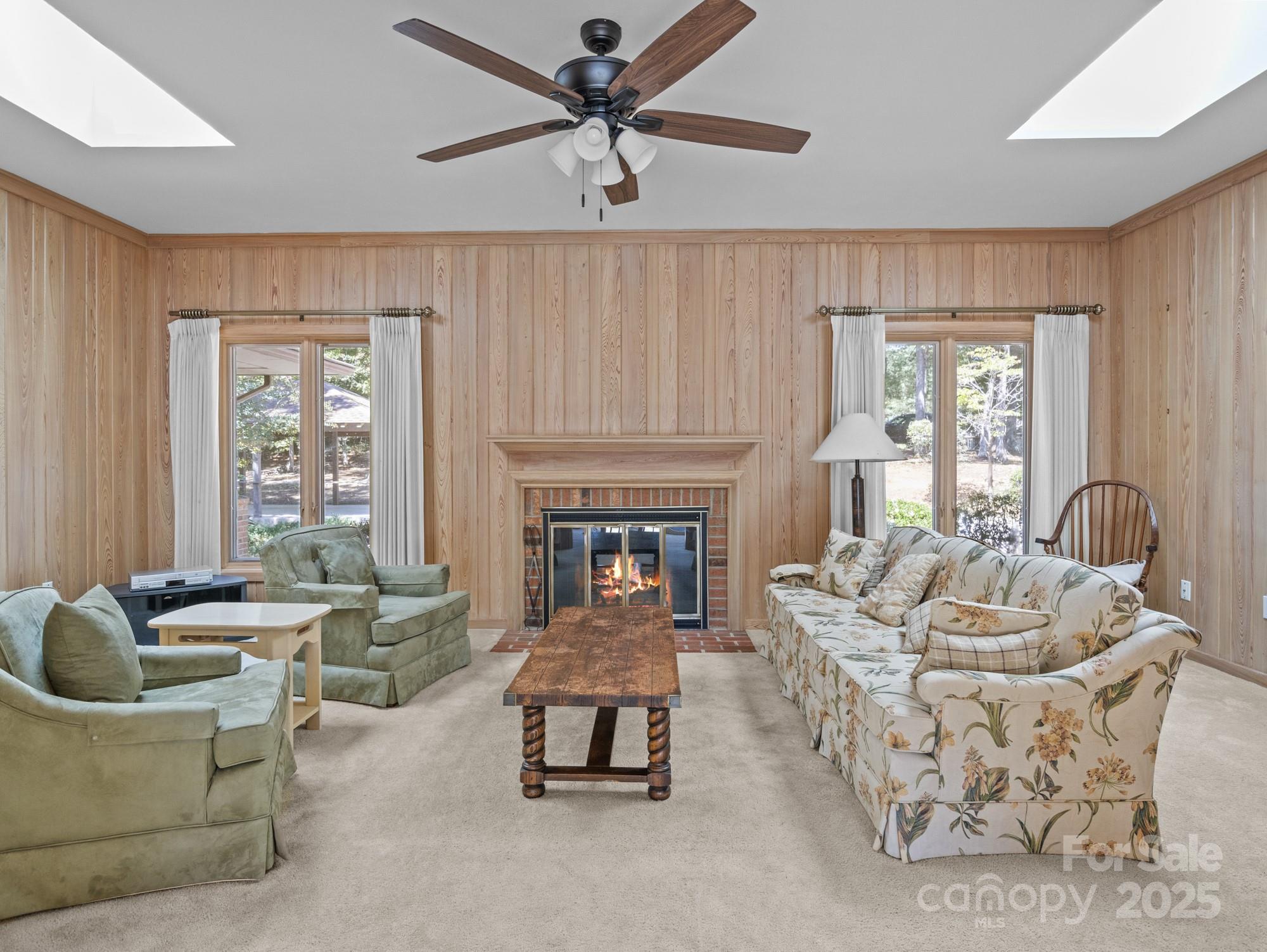 831 Hooper Creek Road Tryon, NC 28782 - Photo 31 of 48 a living room with furniture and a fireplace
