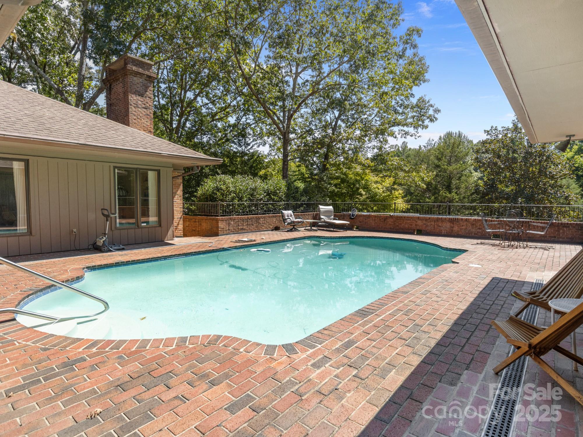 831 Hooper Creek Road Tryon, NC 28782 - Photo 34 of 48 a view of a backyard with swimming pool