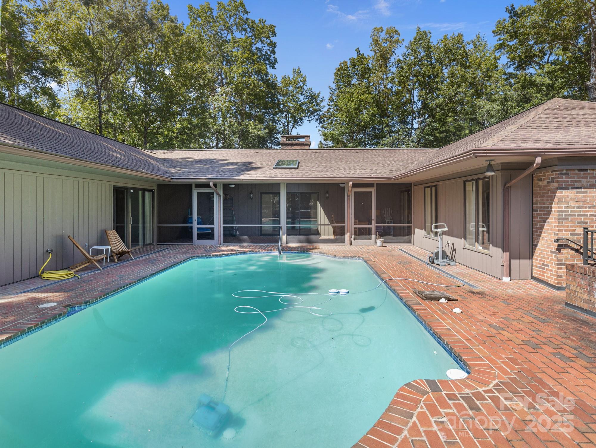 831 Hooper Creek Road Tryon, NC 28782 - Photo 35 of 48 a view of a house with backyard porch and sitting area