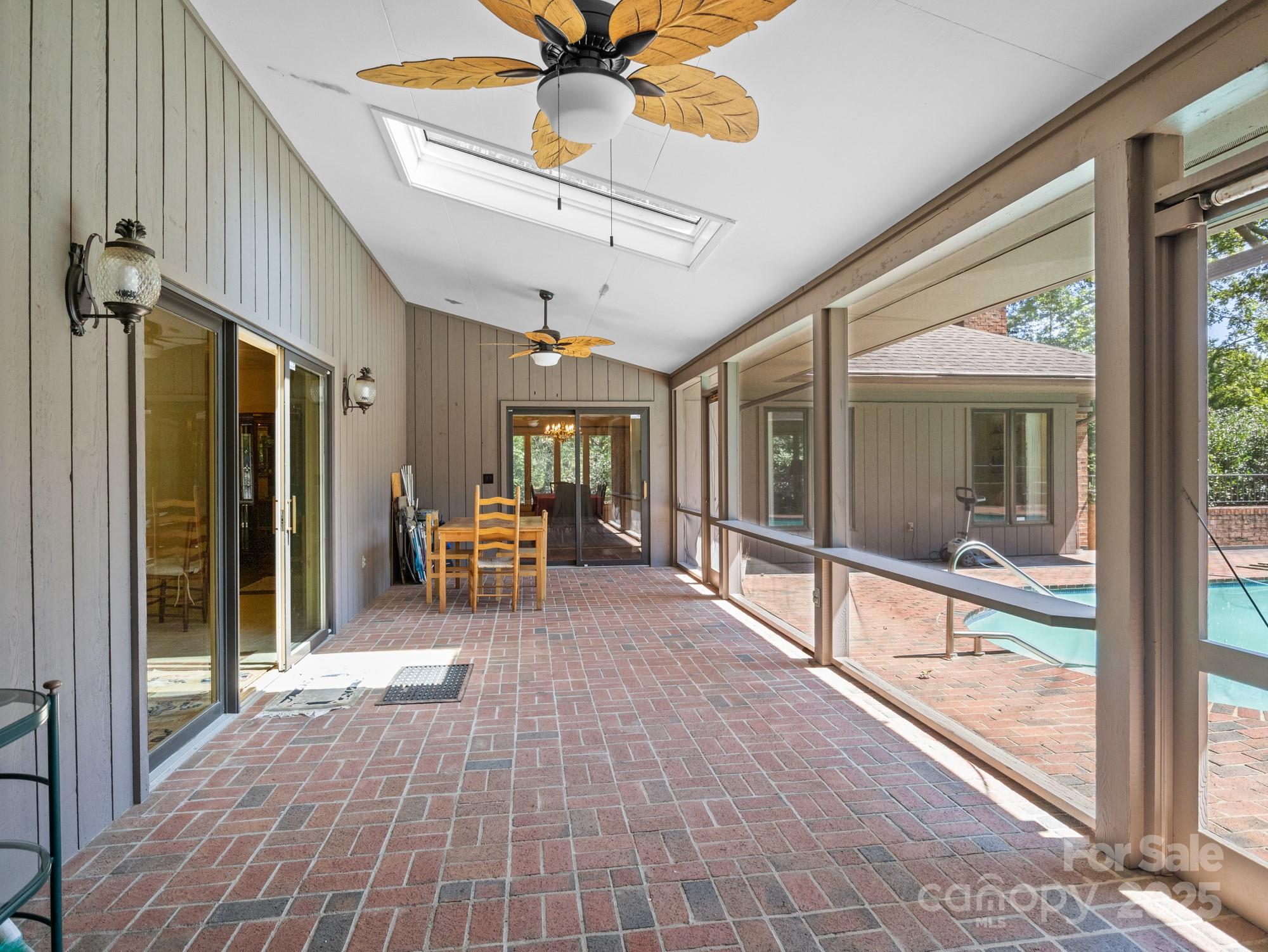 831 Hooper Creek Road Tryon, NC 28782 - Photo 37 of 48 a view of a room with wooden floor and windows