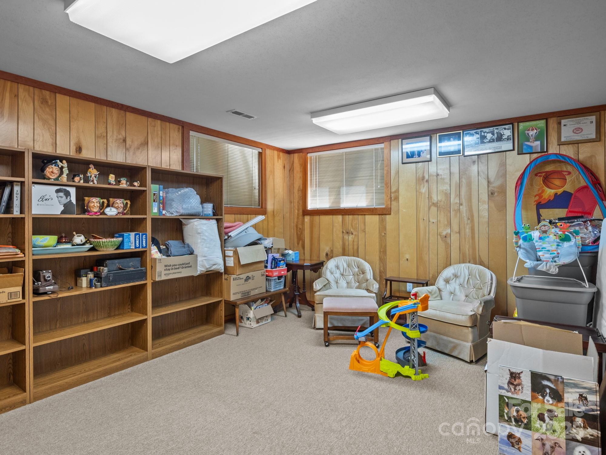 831 Hooper Creek Road Tryon, NC 28782 - Photo 39 of 48 a bedroom with furniture and a window
