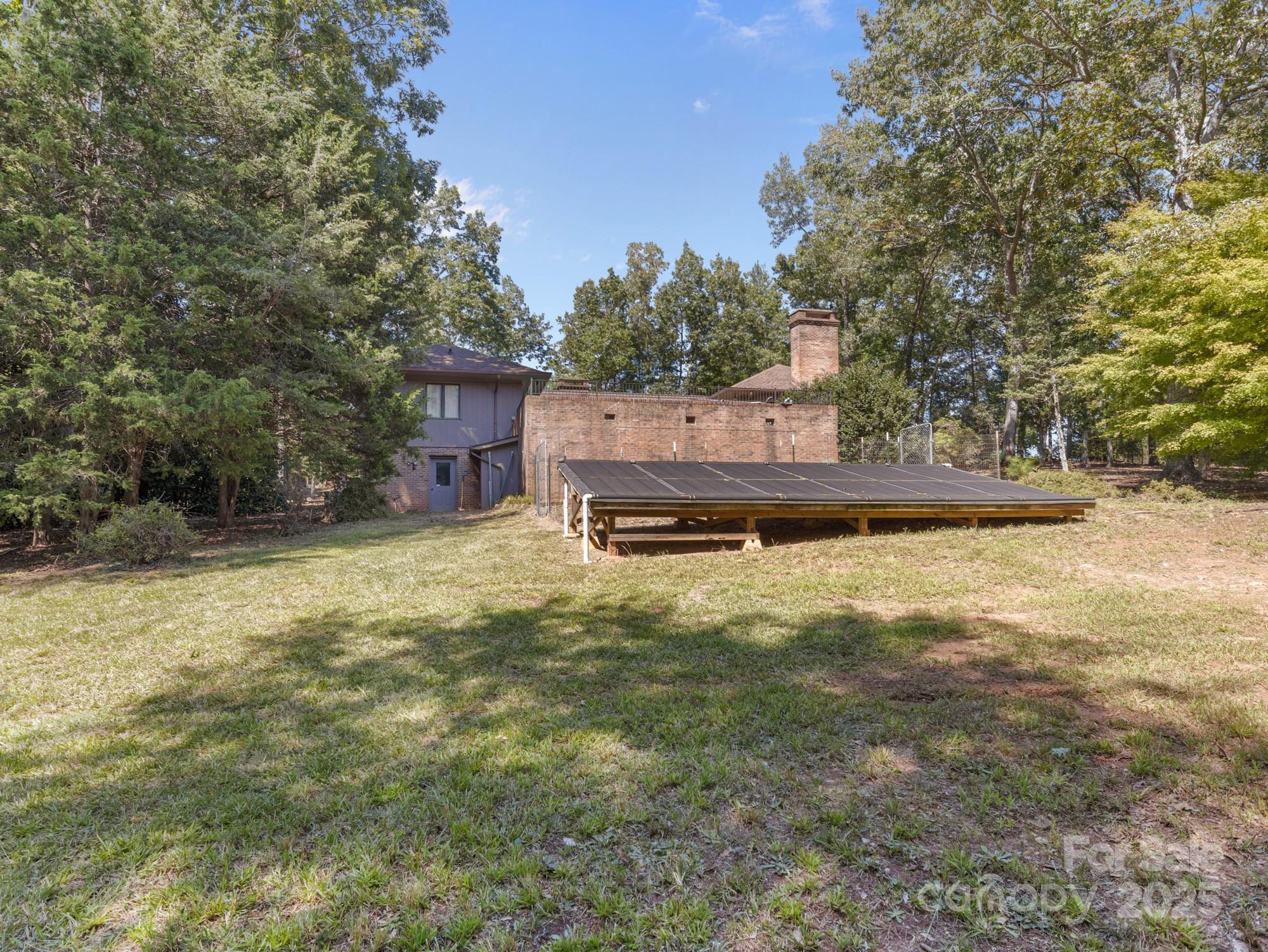 831 Hooper Creek Road Tryon, NC 28782 - Photo 48 of 48 a view of a house with a yard