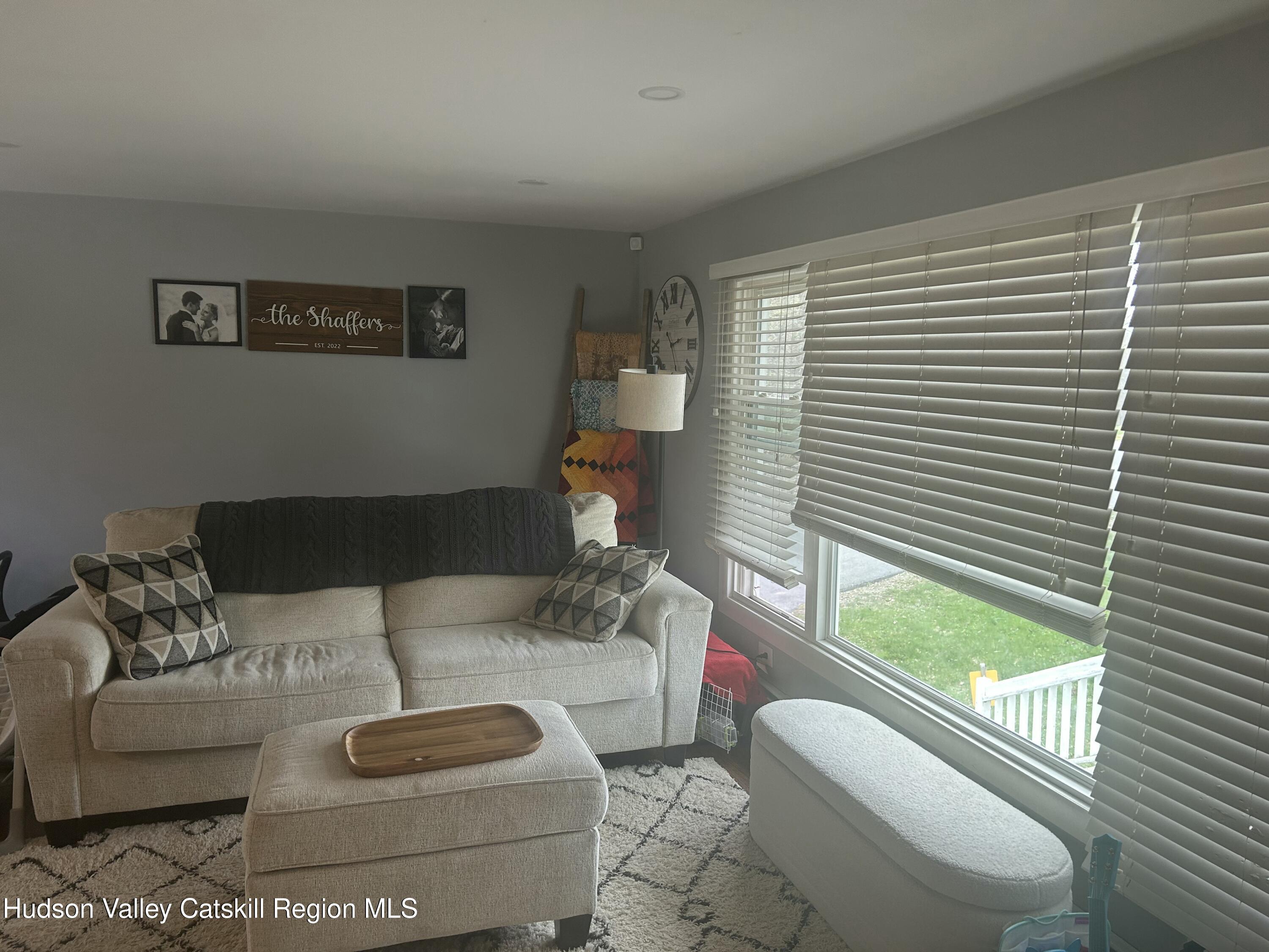 22 Caywood Road Poughkeepsie, NY 12603 - Photo 3 of 27 a living room with furniture and a large window