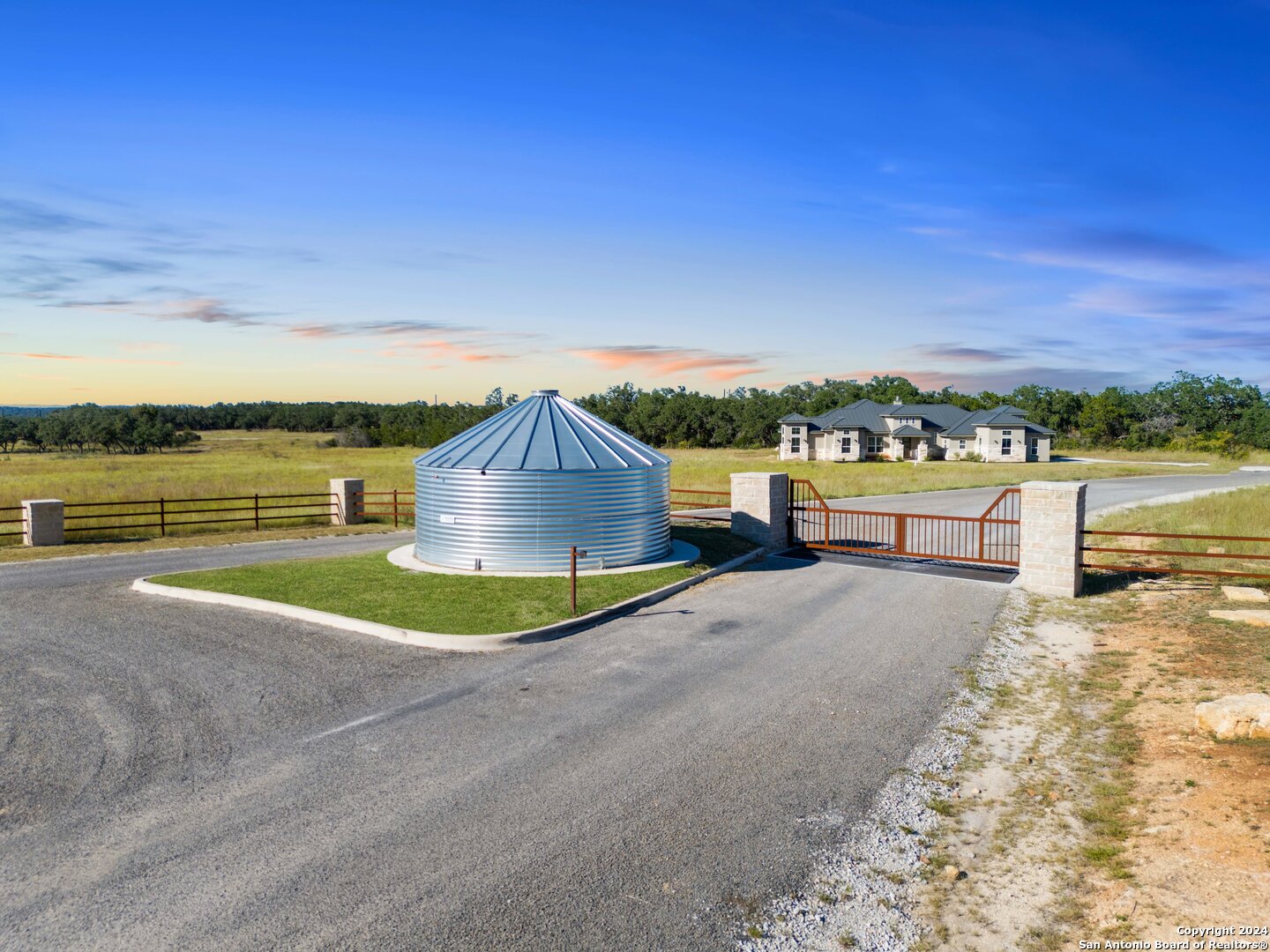 618 Windmill Ridge Drive Blanco, TX 78606 - Photo 13 of 14 a view of a house with a yard and lake view