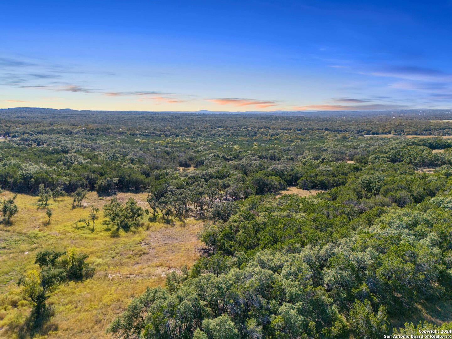 618 Windmill Ridge Drive Blanco, TX 78606 - Photo 7 of 14 a view of a city with top of mountains
