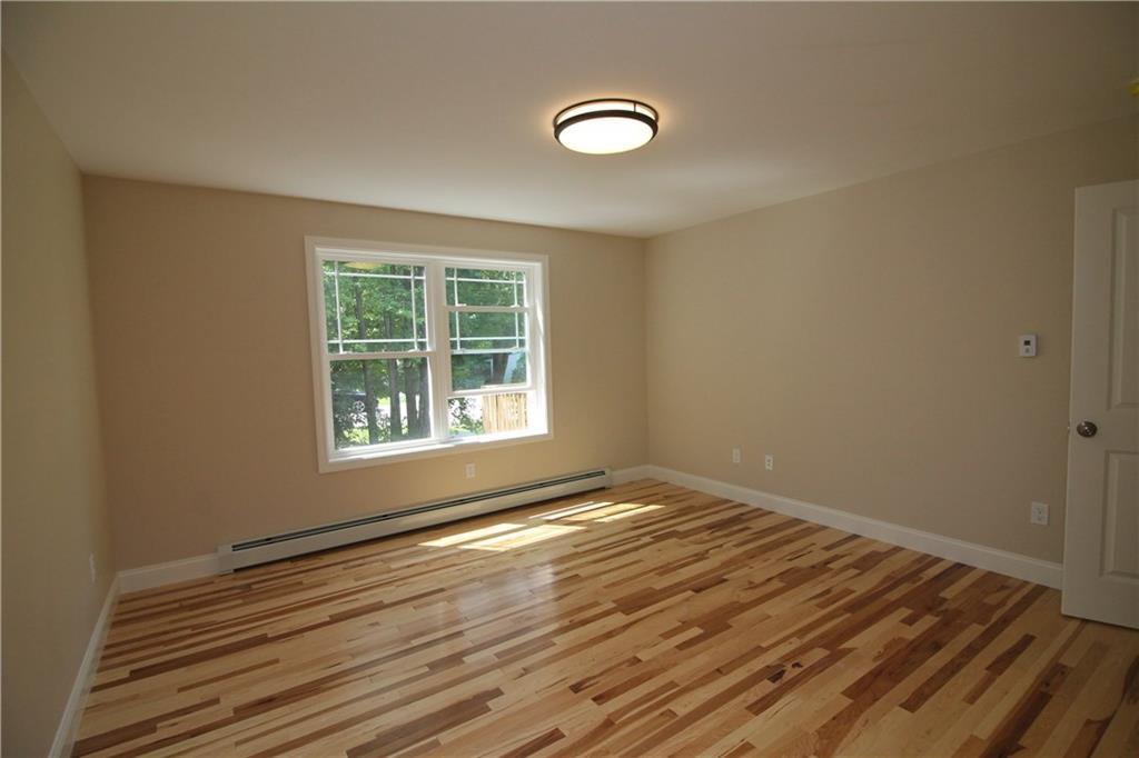 57 Tasker Street Saco, ME 04072 - Photo 8 of 33 First Floor Master Bedroom.