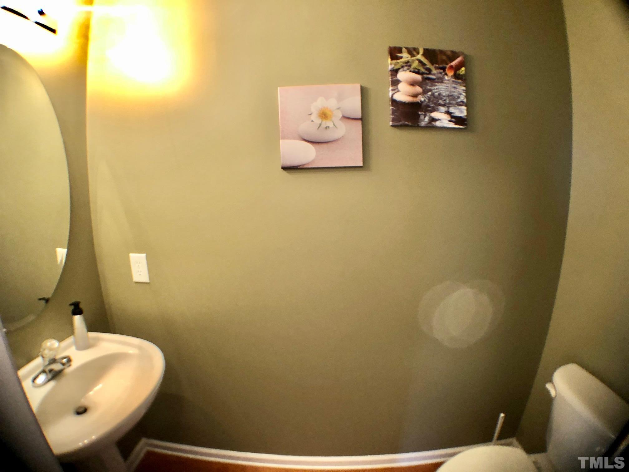 9801 Raleigh, NC 27617 - Photo 13 of 23 a bathroom with a toilet and sink