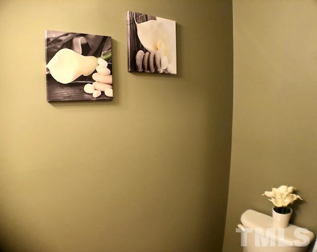 9801 Raleigh, NC 27617 - Photo 14 of 23 a view of utility room with wooden floor and cabinet