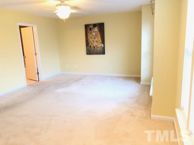9801 Raleigh, NC 27617 - Photo 19 of 23 a view of an empty room with a window