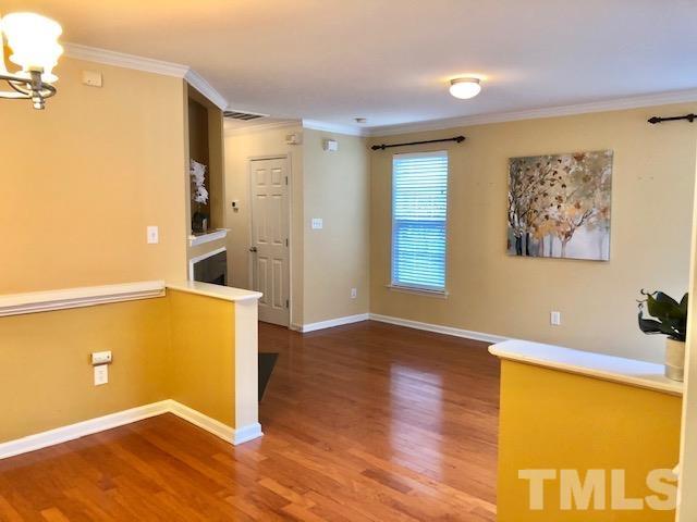 9801 Raleigh, NC 27617 - Photo 3 of 23 a view of a livingroom with wooden floor