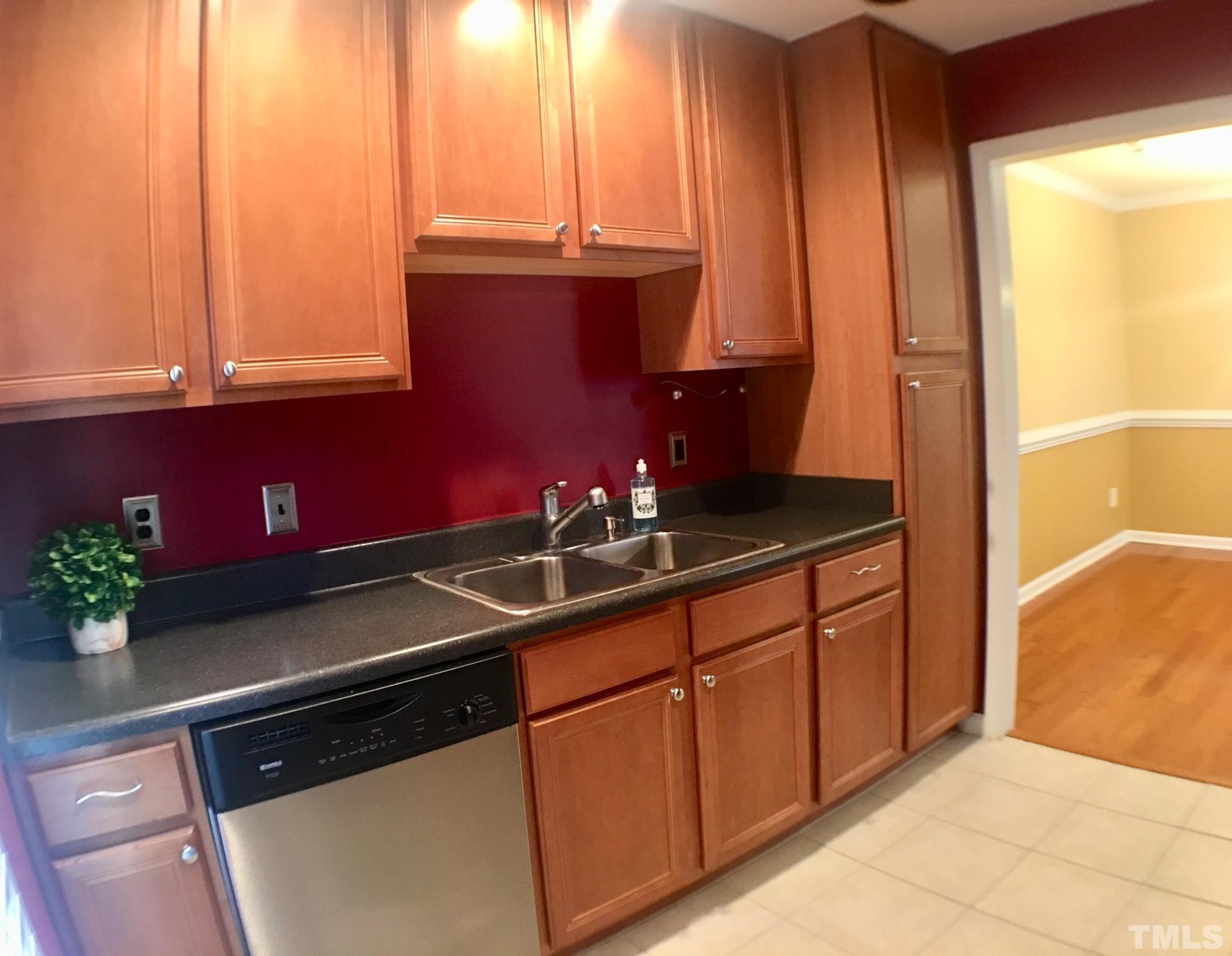9801 Raleigh, NC 27617 - Photo 10 of 23 a kitchen with stainless steel appliances a sink dishwasher and a refrigerator