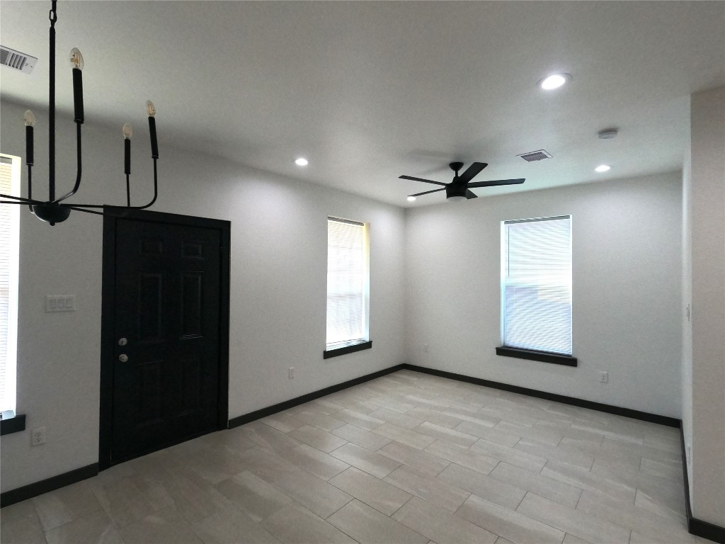 5334 Rapido Road Houston, TX 77033 - Photo 4 of 13 a view of an empty room with a window