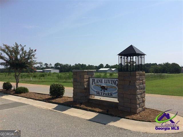 a sign board with a lake view