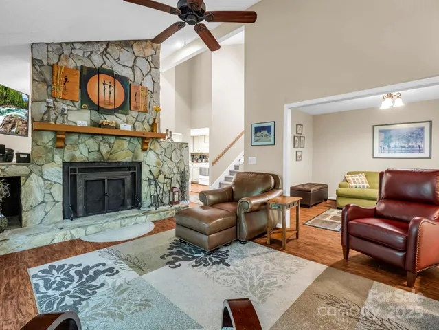 a kitchen with granite countertop a sink stainless steel appliances and cabinets
