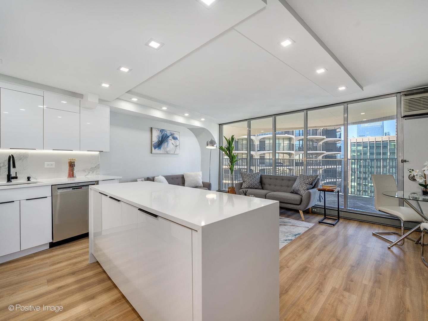 300 North State Street, Unit 5125 Chicago, IL 60654 - Photo 9 of 21 a large white kitchen with a large window