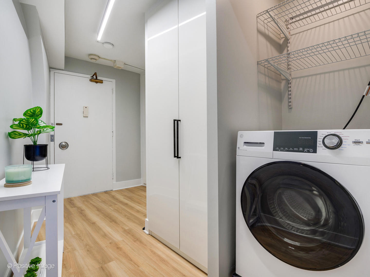 300 North State Street, Unit 5125 Chicago, IL 60654 - Photo 10 of 21 a utility room with sink dryer and washer