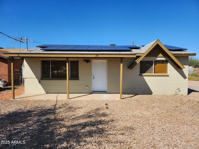 a house with yard in front of it