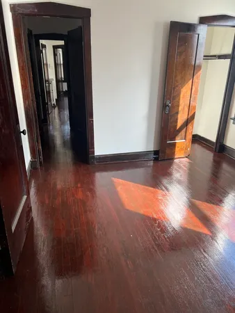 a view of gallery with wooden floor