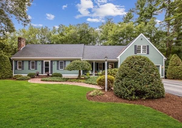 a front view of a house with a yard table and chairs