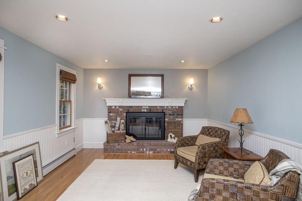 67 Chipaway Road Freetown, MA 02717 - Photo 21 of 32 a living room with furniture and a fireplace