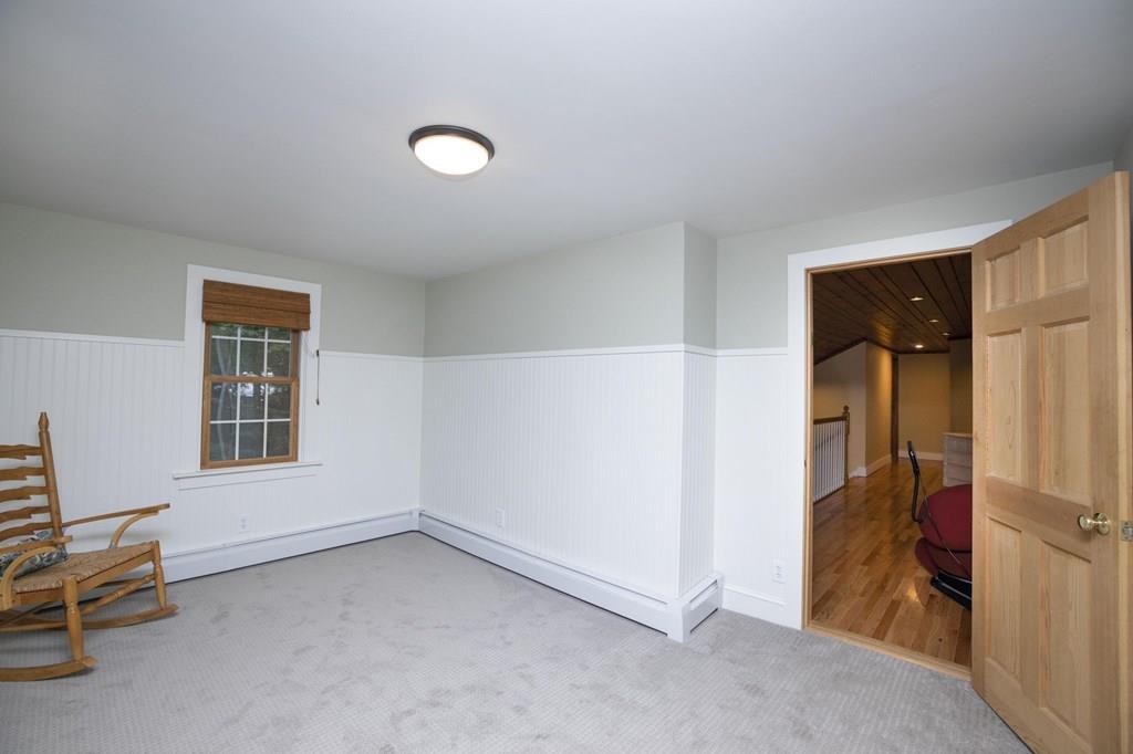 67 Chipaway Road Freetown, MA 02717 - Photo 25 of 32 wooden floor and chair in a room