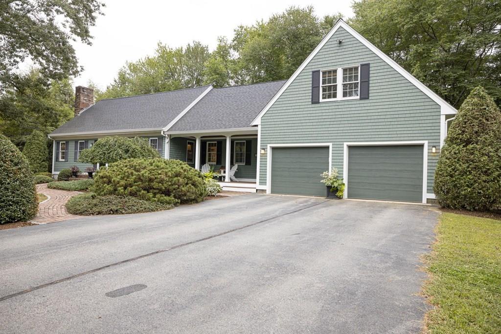67 Chipaway Road Freetown, MA 02717 - Photo 3 of 32 a front view of a house with a yard and garage