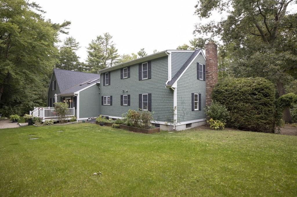 67 Chipaway Road Freetown, MA 02717 - Photo 6 of 32 a front view of a house with a yard and garage
