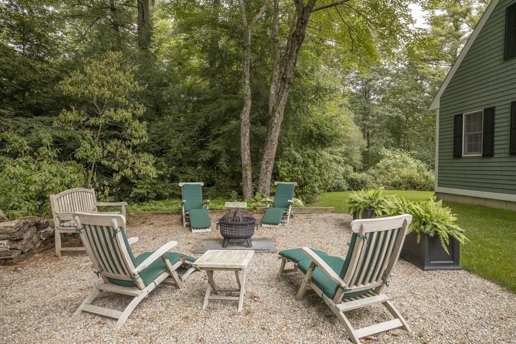 67 Chipaway Road Freetown, MA 02717 - Photo 10 of 32 a view of a chairs and table in the patio