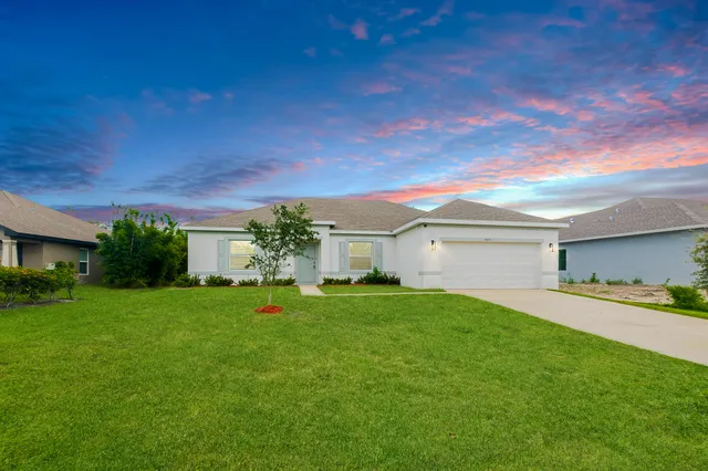 a house view with a garden space