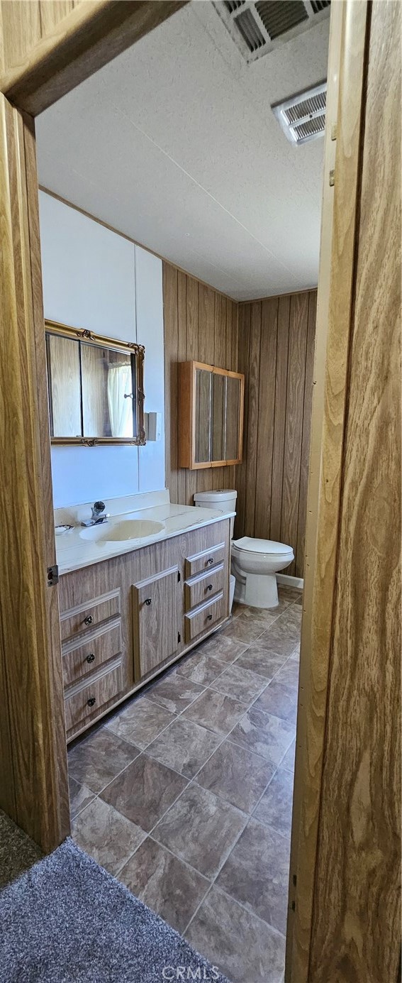 3500 Buchanan Street, Unit 128 Riverside, CA 92503 - Photo 14 of 19 a bathroom with a sink a toilet and mirror