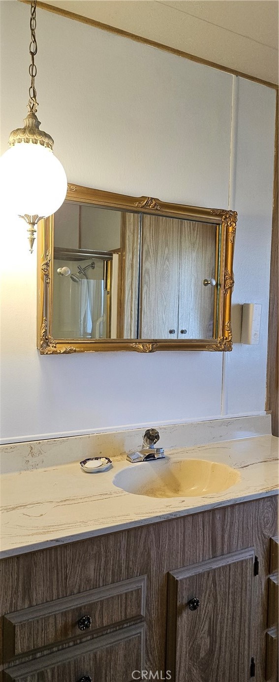 3500 Buchanan Street, Unit 128 Riverside, CA 92503 - Photo 15 of 19 a bathroom with a sink and a mirror