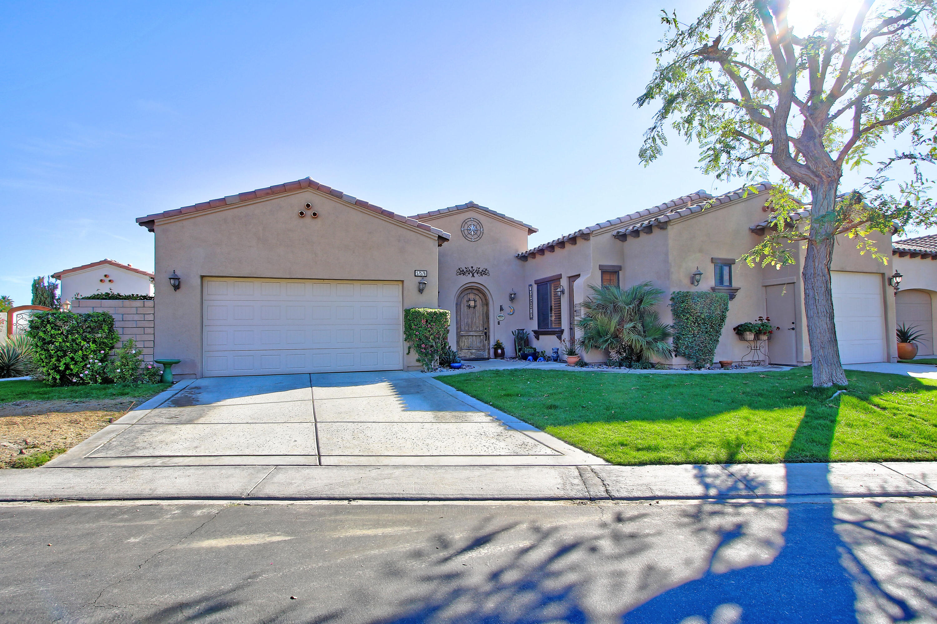 57576 Santa Rosa Trail La Quinta, CA 92253 - Photo 1 of 54 a front view of house with yard