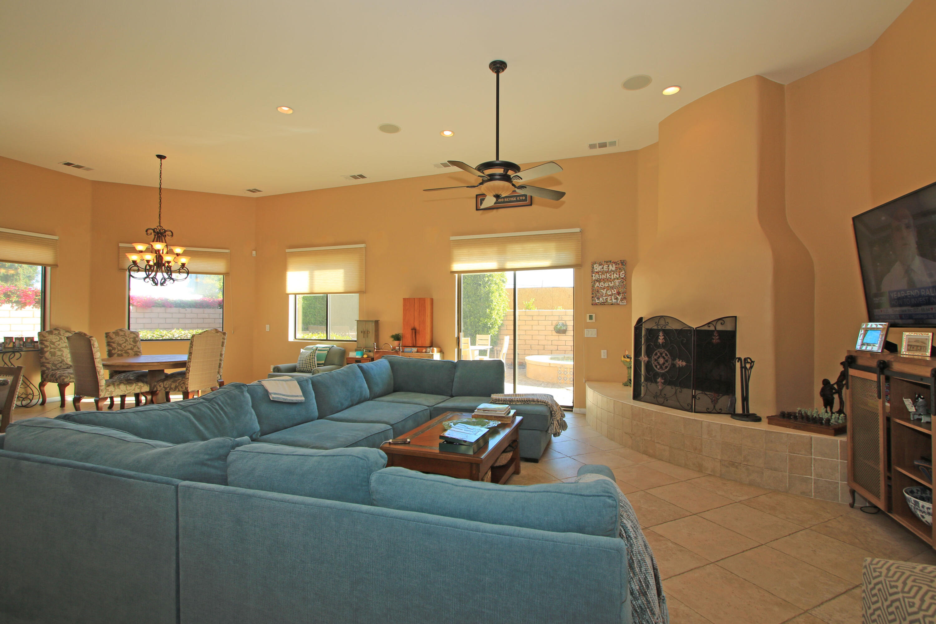 57576 Santa Rosa Trail La Quinta, CA 92253 - Photo 16 of 54 a living room with furniture and a flat screen tv